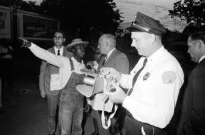 Roosevelt Barnett speaking to L. B. Sullivan, city commissioner of public safety, during a civil rights demonstration in Montgomery, Alabama.