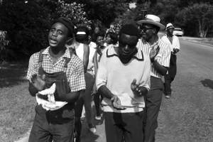 Edward Rudolph leading marchers down a street in Prattville, Alabama, during a demonstration sponsored by the Autauga County Improvement Association.