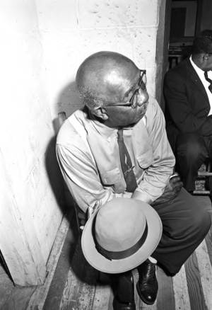 Man listening to a speaker during a meeting at the office of the Autauga County Improvement Association in Prattville, Alabama.