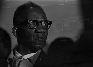 Man sitting in an audience at St. Paul AME Church in Birmingham, Alabama, probably listening to Martin Luther King, Jr., speak.