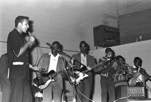 Gene and the Beginners performing on stage at the National Guard Armory on Dallas Avenue in Selma, Alabama, during a dance after a political rally featuring members of SNCC and the Dallas County Independent Free Voters Organization.