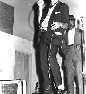 Gene and the Beginners performing on stage at the National Guard Armory on Dallas Avenue in Selma, Alabama, during a dance after a political rally featuring members of SNCC and the Dallas County Independent Free Voters Organization.