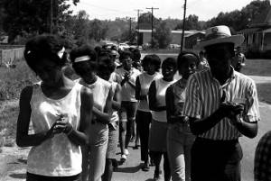 Group marching down a road in Prattville, Alabama, during a demonstration sponsored by the Autauga County Improvement Association.