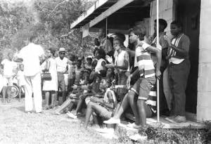 Large group standing on the porch of the Autauga County Improvement Association office in Prattville, Alabama, on the day of a civil rights march.