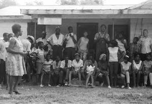 Edward Rudolph and others, standing on the porch of the Autauga County Improvement Association office in Prattville, Alabama, on the day of a civil rights march.