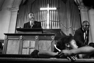 Man speaking to an audience at Brown Chapel AME Church in Selma, Alabama.