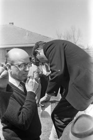 Clergyman stepping off a platform after addressing an audience in George Washington Carver Park in Selma, Alabama, during a commemoration of the Selma to Montgomery March.