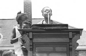 Children around a podium in George Washington Carver Park in Selma, Alabama, during a commemoration of the Selma to Montgomery March.