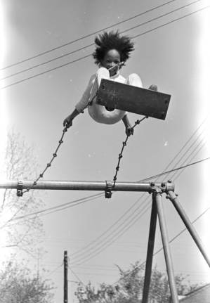 Sheyann Webb on a swing in George Washington Carver Park in Selma, Alabama, during a commemoration of the Selma to Montgomery March.