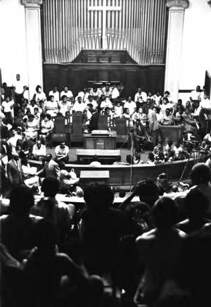 Man speaking to an audience at Brown Chapel AME Church in Selma, Alabama.