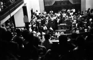 C. T. Vivian speaking to a man at the podium at Brown Chapel AME Church in Selma, Alabama.