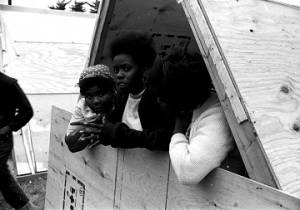 Three woman inside a plywood shack in Resurrection City, an encampment constructed on the National Mall in Washington, D.C., during the Poor People's Campaign.