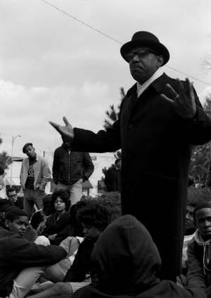 Man addressing students from Tuskegee Institute during a demonstration to protest the murder of Samuel L. Younge, a civil rights worker.