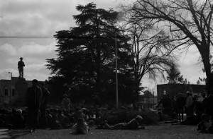 Crowd seated in front of the Confederate monument in Tuskegee, Alabama, during a student demonstration to protest the murder of Samuel L. Younge, a civil rights worker.