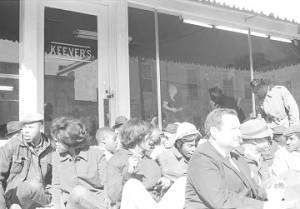Students from Tuskegee Institute on the sidewalk in front of Keever's store, during a demonstration to protest the murder of Samuel L. Younge, a civil rights worker.