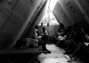 Woman and children inside a plywood shack in Resurrection City, an encampment constructed on the National Mall in Washington, D.C., during the Poor People's Campaign.