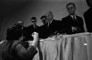 Woman speaking to Senators George Murphy, Jacob Javits, and Joseph Clark before or after a hearing held by the Senate Subcommittee on Employment, Manpower, and Poverty at the Heidelberg Hotel in Jackson, Mississippi.