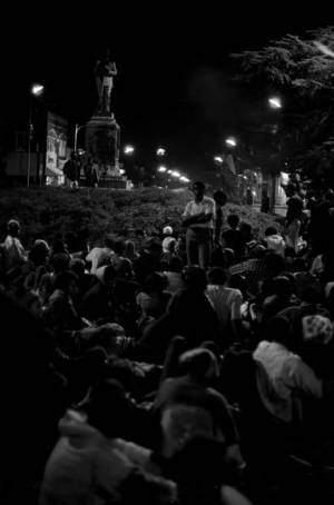 Crowd seated in front of the Confederate monument in Tuskegee, Alabama, during a student demonstration to protest the murder of Samuel L. Younge, a civil rights worker.