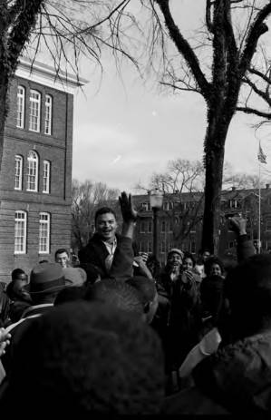 Wendell Wilkerson addressing students gathered outside the Collis P. Huntington Memorial Building at Tuskegee Institute, during a demonstration to protest the murder of Samuel L. Younge, a civil rights worker.
