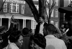 Wendell Wilkerson addressing students gathered outside the Collis P. Huntington Memorial Building at Tuskegee Institute, during a demonstration to protest the murder of Samuel L. Younge, a civil rights worker.
