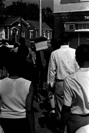 Group marching in downtown Tuskegee, Alabama, during a student demonstration to protest the verdict in the trial of Thomas Coleman, a Lowndes County man who had been charged with the murder of Jonathan Daniels.