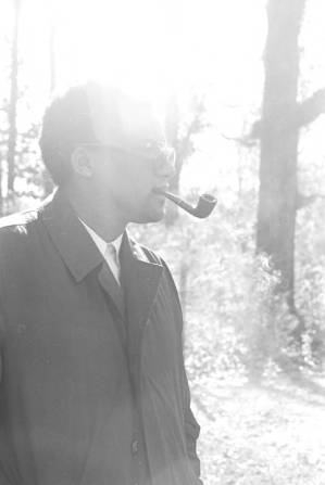 Men smoking a pipe during a student demonstration in Tuskegee, Alabama, to protest the murder of Samuel L. Younge, a civil rights worker.