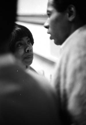 Gwen Patton talking to George Ware at the Tuskegee Institute gymnasium, during a meeting held to discuss student demonstrations protesting the murder of Samuel L. Younge.
