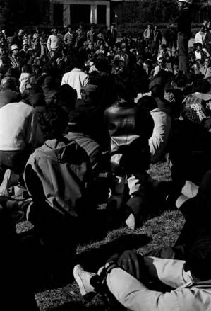 Wendell Paris addressing students gathered outside the Hollis Burke Frissell Library at Tuskegee Institute, during a demonstration protesting the murder of Samuel L. Younge.