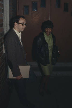 Michael Lottman and Sarah Heggie, staff members for the Southern Courier, standing outside before a mass meeting at Tabernacle Baptist Church in Birmingham, Alabama.