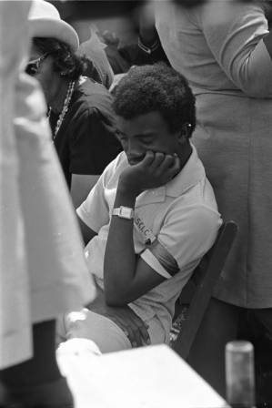 Close-up of young man among mourners at Martin Luther King's funeral.