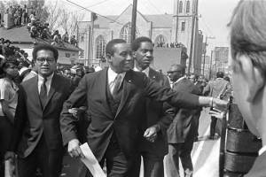 Floyd McKissick walking down Auburn Avenue toward Ebenezer Baptist Church for Martin Luther King, Jr.'s funeral.