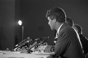 Senator Robert F. Kennedy of the Senate Subcommittee on Employment, Manpower, and Poverty, listening to testimony during a hearing at the Heidelberg Hotel in Jackson, Mississippi.