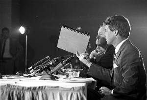 Senators George Murphy, Joseph Clark, and Robert F. Kennedy of the Senate Subcommittee on Employment, Manpower, and Poverty, listening to testimony during a hearing at the Heidelberg Hotel in Jackson, Mississippi.