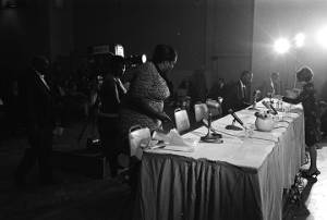 Fannie Lou Hamer sitting down at a table before the Senate Subcommittee on Employment, Manpower, and Poverty, during a hearing at the Heidelberg Hotel in Jackson, Mississippi.