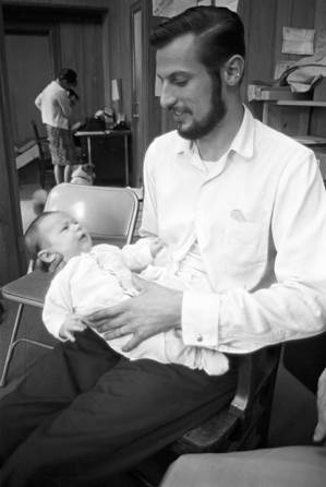 Paul Bokulich, SCLC worker in Greene County, Alabama, with his infant daughter, Rebecca.