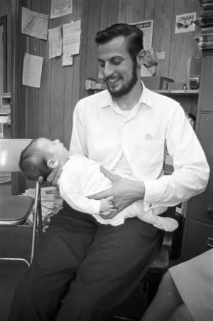 Paul Bokulich, SCLC worker in Greene County, Alabama, with his infant daughter, Rebecca.