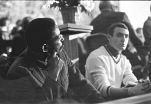 Two men in an audience, probably listening to Martin Luther King, Jr., speak at Maggie Street Baptist Church in Montgomery, Alabama.