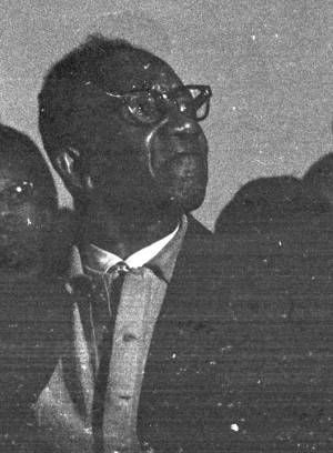 Man sitting in an audience at St. Paul AME Church in Birmingham, Alabama, probably listening to Martin Luther King, Jr., speak.