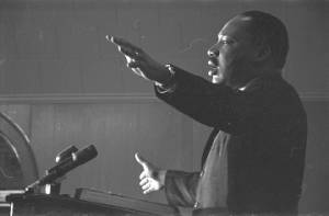Martin Luther King, Jr., speaking to an audience in a church building.