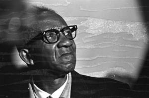 Man sitting in an audience at St. Paul AME Church in Birmingham, Alabama, probably listening to Martin Luther King, Jr., speak.