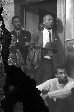 Men standing and sitting around a doorway at St. Paul's CME Church in Selma, Alabama, during a meeting sponsored by the Southern Christian Leadership Conference.