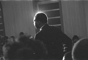 Martin Luther King, Jr., speaking to an audience in a church building.