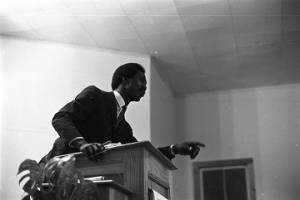 Thomas Gilmore speaking to an audience at First Baptist Church in Eutaw, Alabama.