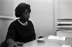 Idessa Williams of the Montgomery Improvement Association, seated at a table during an interview.