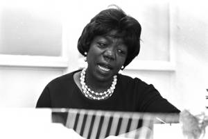 Idessa Williams of the Montgomery Improvement Association, seated at a table during an interview.