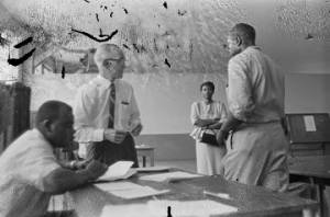 Federal examiners registering a man to vote at the Fort Charles Henderson armory in Troy, Alabama.