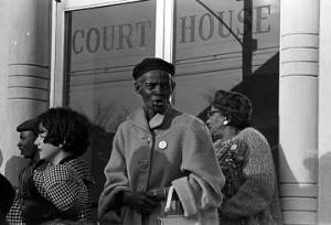 Women standing on the steps outside a courthouse in Birmingham, Alabama, during a voter registration drive.
