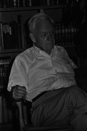 Moreland Smith, chairman of the Alabama Advisory Committee to the U.S. Commission on Civil Rights, seated in a personal library or study during an interview.