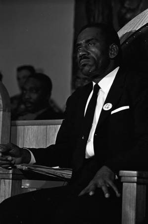 Edward Gardner of the Alabama Christian Movement for Human Rights, seated behind the speaker during a meeting at St. Paul AME Church in Birmingham, Alabama.