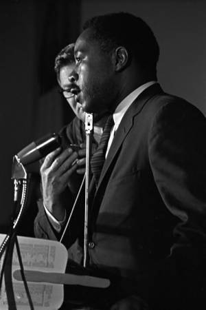 Man speaking to an audience at St. Paul AME Church in Birmingham, Alabama